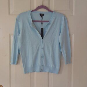 The V-neck light blue cardigan is versatile and casual